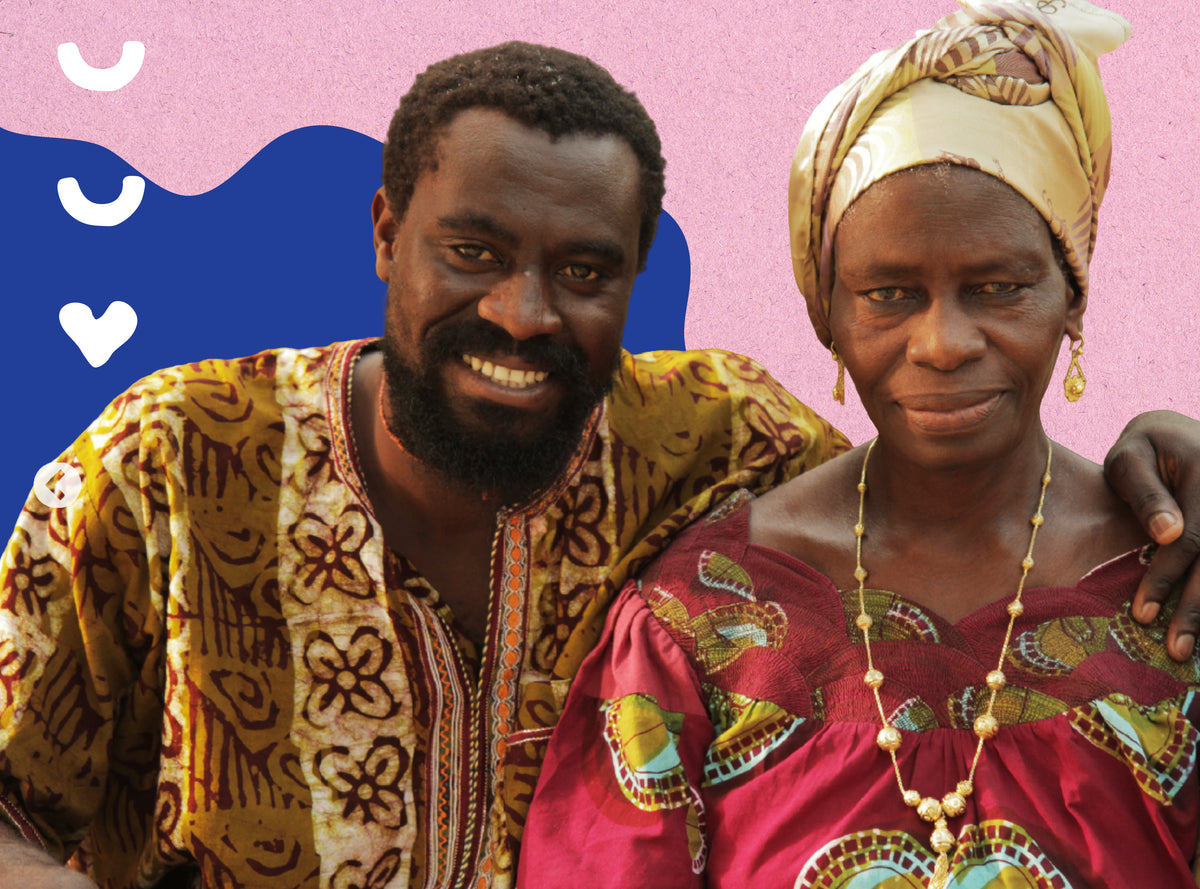 Olowo-n'djo and his mother, Ina, smiling side by side in colorful patterned clothing against a pink textured background with a blue shape and white heart.